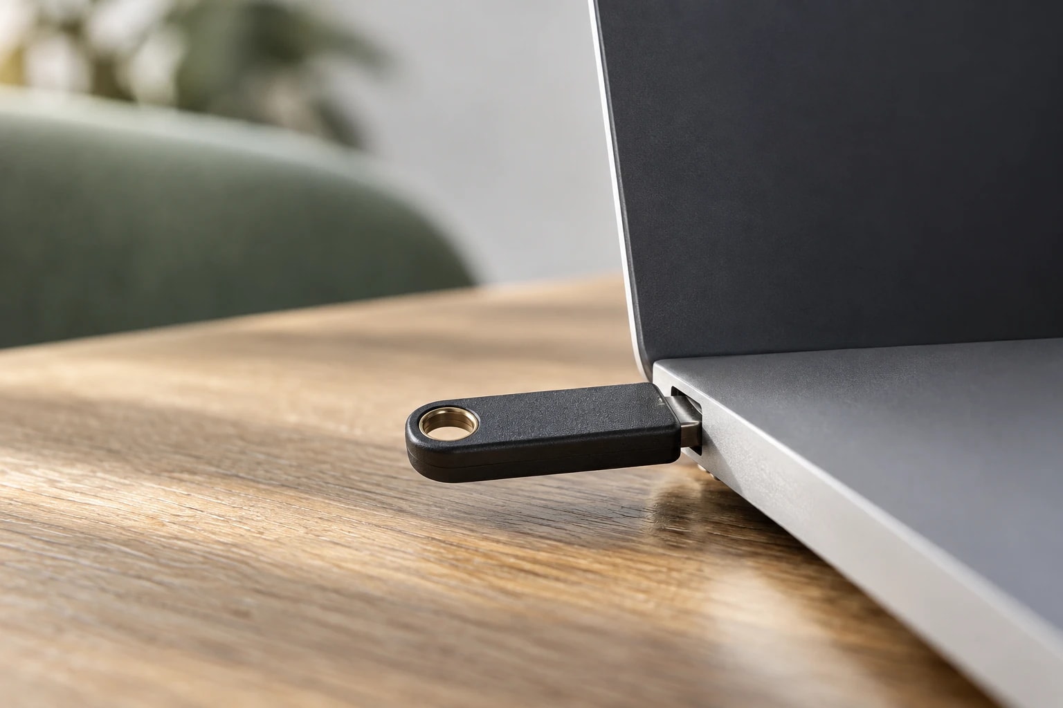 Illustrative: close-up of a hardware security key plugged into a laptop